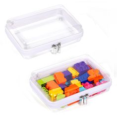 two plastic containers filled with colorful lego blocks