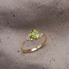 Guaranteed to take your breathe away, the princess cut peridot stone at the core of the Juliette is serene. The peridot is adorned with 10 dazzling white diamonds, contributing extra glamour to the ring. The elegance of this piece is incomparable as it radiates royalty and allure. All features can be customized! Please contact us if you wish to make changes, we love making custom designs. All of our jewelry is carefully handmade in our atelier. *HC diamond are all conflict-free diamonds To order by phone 972-72-2991000 Peridot Diamond Ring, Letter Bracelet, Peridot Stone, Pendant Rings, Bracelet Collection, Girls Earrings, The Princess, Diamond Bracelets, Conflict Free Diamonds