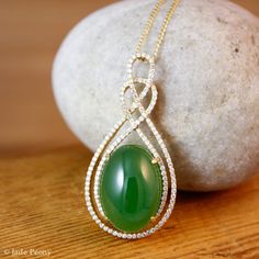 "Here is a beautiful translucent large oval green nephrite jade pendant set with pave diamonds in solid 18KT yellow gold. The jade is set in a double infinity love knott halo setting and is surrounded by pave set round diamonds. The jade is about 14x18mm and is approx. 14.45 carats. The total weight of the brilliant cut round white diamonds is 0.49 carats. The pendant is about 1 1/2\" long. The chain is 14KT gold and is 16\" long. If you do not want the chain, please convo us and we will adjust Elegant Oval Jade Jewelry, Elegant Oval Cabochon Jade Jewelry, Double Infinity, Infinity Love, Lucky Green, Nephrite Jade, Halo Setting, Halo Pendant, Double Halo