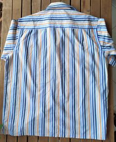 vintage 90's Engbers striped Shirt, Vintage Shirt, cotton Shirt, vintage clothing, 90's clothing, men's vintage shirt, Button Downs shirt A lovely Engbers shirt from 90's. It is 100% cotton and in excellent condition. size: 2XLarge (better look measurements): measurements: Sleeves: 27 cm - 10.62 inches Shoulder to Shoulder (from seam to seam) 51 cm - 20.07 inches armpit to armpit - 68 cm -26.77 inches Waist (double that) 65 cm - 25.59 inches Length (measured at the back without collar) 83 cm - 3 Cotton Short Sleeve Shirt With Vertical Stripes For Spring, Spring Cotton Short Sleeve Shirt With Vertical Stripes, Striped Short Sleeve Cotton Shirt With Relaxed Fit, Striped Cotton Short Sleeve Shirt Relaxed Fit, Relaxed Fit Short Sleeve Cotton Shirt With Vertical Stripes, Cotton Button-up Tops With Horizontal Stripes, Vintage Cotton Tops With Vertical Stripes, Striped Collared Short Sleeve Cotton Shirt, Striped Cotton Collared Short Sleeve Shirt