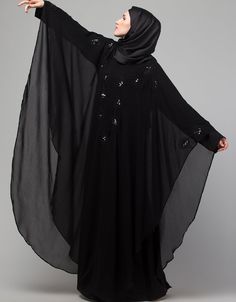 Beautiful Black Color embroidery Abaya easy to wear Back close with loop, button & zip, easy to wear embroidery On Chest Hijab and band shown in the image can be bought separately Fabric: PartyCare: Mild machine wash/ hand Cold Wash/Dry cleanWe request customers to carefully choose the correct size and dress length referring to our size chart Long Black Abaya For Eid, Black Long Khimar For Eid, Black Long Kaftan With Dabka Work, Black Long Sleeve Hijab For Eid, Black Long Sleeve Kaftan For Eid, Traditional Black Dabka Khimar, Black Kaftan With Dabka Work For Eid, Long Sleeve Black Khimar For Eid, Black Long Sleeve Khimar For Eid