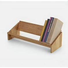 a wooden book stand with books on it