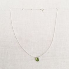 "This is a peridot necklace made of genuine high quality faceted peridot. There are gold filled ,sterling silver and 14kt gold chain you can choose from. Each necklace has 2\" extender. There are 2 sizes that you can choose from 14\"-16\" and 16\"- 18\" in gold filled or sterling silver. 14k gold necklace will be in single size without extender.This is a August birthstone necklace. Peridot jewelry is light weight and elegant. This green peridot is around 1 carats. The green stone necklace is gre Green Minimalist Gemstone Birthstone Necklace, Green Peridot Necklace For May Birthstone, Lime Green Peridot Necklace For May Birthstone, Green Peridot Gemstone Necklace, Green Sterling Silver Necklace With Delicate Chain, Green Peridot Pendant Necklace, Oval Green Peridot Necklaces, Green Peridot Necklace For Gift, Oval Peridot Necklace For May Birthstone