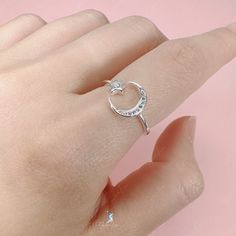 Experience the magic of the crescent moon and star with our adjustable open band ring. Made from solid 925 sterling silver and polished to perfection, it radiates beauty and shine. Add this celestial piece to your ring collection or give it as a heartfelt gift to your loved one. Materials: 925 sterling silver, cubic zirconiaAdjustable up to size US 8. Jewelry Care: See more information about how to care for your jewelry here. Shipping Policy: Orders will be shipped within 1-3 business days. Econ Latest Earrings Design, Crescent Moon And Star, Gothic Ring, Everyday Ring, Earrings Design, Gothic Rings, Moon Ring, Ring Collection, Moon And Star