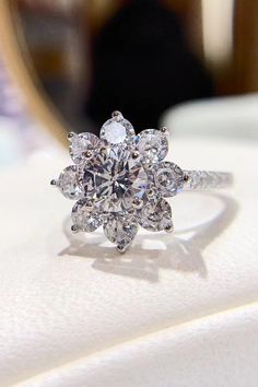 a diamond ring sitting on top of a table