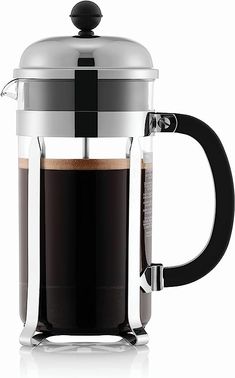 a french press coffee maker with a glass lid and black handle, on a white background