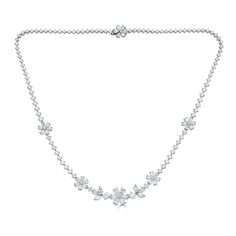 This impressive 18kt white gold necklace features 10.32cts of sparkling pear, marquise, and round diamonds in an elegant floral design. Handcrafted in Italy by ZYDO Italian Jewelry.Diamond Quality: Color F, Clarity VSDiamond Carat Weight: 10.32Dimension: Width Bottom Flower: 1/2 in.Length: 16 3/16 in. Flower Diamond Necklace, Diamond Flower Necklace, Luxury Diamond White Necklace With Flower Pendant, Fine Jewelry Flower-shaped Diamond Necklace, Fine Jewelry White Gold Flower-shaped Diamond Necklace, Luxury Diamond Flower-shaped Necklace For Wedding, Luxury Diamond White Flower-shaped Necklaces, White Gold Necklaces, Diamond Flower