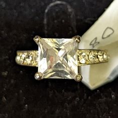 an engagement ring with a princess cut diamond