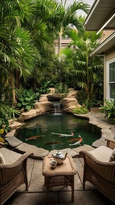 a small pond in the middle of a patio with wicker chairs and coffee table