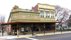 an old building on the corner of a street