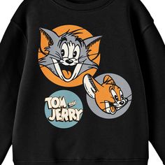 Celebrate your favorite cartoons in comfort with this Tom & Jerry sweatshirt. The sweatshirt features illustrations of Tom and Jerry in orange and in orange and gray circles while the series logo appears in a blue circle next to the characters. The sweatshirt comes in a black long sleeve crew neck. Tom & Jerry fans will love this comfy and cozy sweatshirt.