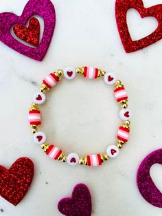 Super cute bracelet to wear as you celebrate Valentine's Day! Bracelet can be personalized upon request.  💟Choose your size and at checkout.  💟Please indicate the desired sizing within the customization section. Sizing length is as follows:  Women's small: 6.5 inches Women's medium: 7 inches Women's large: 7.5 inches Women's XL: 8 inches Children's 4-5 years old: 5.75 inches Children's 6-7 years old: 6 inches Children's 8-9 years old: 6.25 inches Children's 10-13 years old: 6-7 inches 💟Listin Valentine's Day Friendship Bracelets With Heart Beads, Valentine's Day Friendship Name Bracelet, Adjustable Name Bracelet With Heart Charm For Valentine's Day, Valentine's Day Adjustable Name Bracelet With Heart Charm, Friendship Letter Bead Charm Bracelet For Valentine's Day, Adjustable Heart Charm Name Bracelet For Valentine's Day, Valentine's Day Heart Bracelet With Letter Beads For Friendship, Personalized Gift Charm Bracelet For Valentine's Day, Cute Heart Beaded Bracelets For Valentine's Day