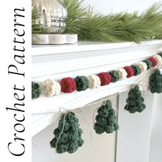 crocheted christmas tree garland on mantle with pine cones and red balls hanging from it