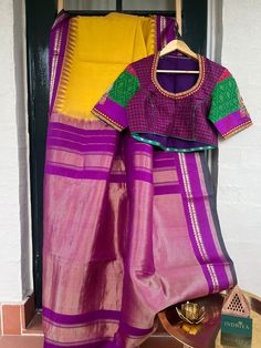 Saree: Gadwal Fabric: Silk Cotton Body: Mustard Blouse and Pallu: Violet Note: The blouse in the picture is sold separately, the saree comes with an attached blouse fabric. Pls follow us on *Instagram*  https://www.instagram.com/indriya_curations?igsh=MWt5bnlwd3VlZW9kZg%3D%3D&utm_source=qr *Facebook* https://www.facebook.com/profile.php?id=100095257676636&mibextid=LQQJ4d #indriyacurations #indriya #indriyasilksarees #kanjeevaramsilksarees #globalshipping #kanjeevaramsilk #globalshipping📦 #kanje Purple Silk Handloom Pre-draped Saree, Purple Cotton Silk Blouse With Zari Weaving, Designer Cotton Silk Purple Saree, Designer Purple Cotton Silk Saree, Purple Zari Weaving Traditional Wear In Cotton Silk, Purple Cotton Silk Traditional Wear With Zari Weaving, Purple Semi-stitched Cotton Silk Traditional Wear, Festive Purple Cotton Silk Pre-draped Saree, Festive Purple Pre-draped Cotton Silk Saree