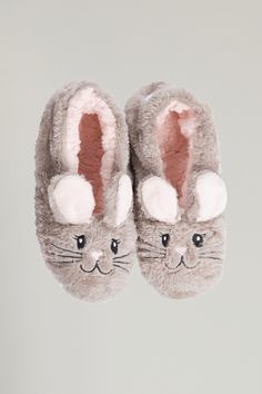 Our Snuggle Bunny Footsies make everyone say, "Awww." These footsie slippers are plush inside and out with an adorable bunny design in front and "Snuggle Bunny" messaging on the back. These cozy snuggle bunny footsies will be friends to cold toes everywhere. In women’s sizes S, M, L, XL. Stretch-fit so your toes can wiggle. Perfect for throwing your bunny hoppers up for a night in and relaxing on your couch in your favorite Faceplant Bamboo. For inside relaxing only. Plush and warm, finished wit Spring Long Sleeve Footie For Bedtime, Fluffy Bunny Slippers, Pink Fluffy Bunny Slippers, Bunny Slippers For Baby, Spring Bedtime Footie, Bunny Slippers, Best Slippers, Blue Q, Local Gifts