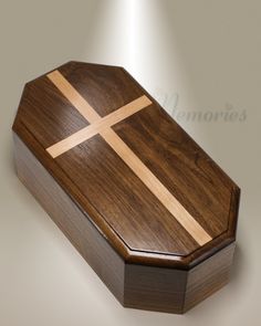 a wooden box with a cross on it