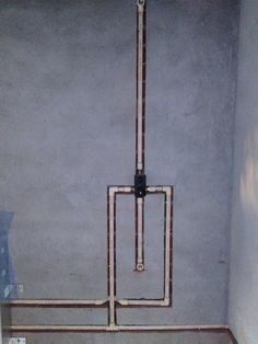 the pipes are connected to the toilet in the bathroom wall, and there is no water coming from it