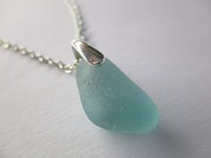 GENUINE SEA GLASS NECKLACE NATURAL UNENHANCED AQUA BLUE Nugget Gem Sea Glass measures 19mm x 11mm x 8mm. STERLING SILVER Chain and Bail. REAL SURF TUMBLED Found by me on a beautiful Greek beach. Comes in a lovely gift box. Thanks for visiting! Light Blue Glass Jewelry For Gifts, Light Blue Glass Jewelry Gift, Light Blue Glass Jewelry For Gifting, Blue Glass Necklaces With Adjustable Chain, Blue Nickel Free Necklace With Recycled Glass, Blue Recycled Glass Nickel-free Necklace, Greek Beach, Seaglass Jewelry, Natural Linen Dress