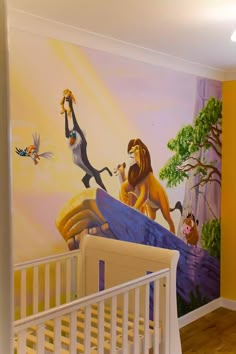 the lion king mural is on the wall in this child's room with white crib