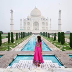 a woman standing in front of the tajwa