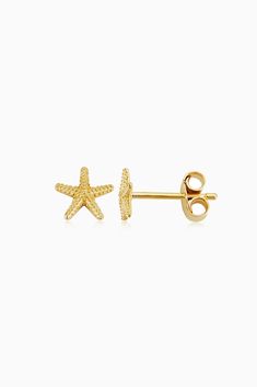 Designed with tropical vacations in mind, our Starfish Studs feature two intricately crafted solid gold starfish. Pair these earrings with other ocean-inspired jewelry, or let them shine solo. 14k Solid Yellow Gold Push Back Closure 0.5 Grams Solid Gold Crafted in Vicenza, Italy Ocean-inspired Yellow Gold Earrings As Gift, 14k Yellow Gold Starfish Jewelry, Yellow Gold Ocean-inspired Earrings For Gift, Gold Starfish Charm Earrings For Beach, Elegant Yellow Gold Earrings With Starfish Charm, Yellow Gold Starfish Earrings For Gift, Yellow Gold Starfish Jewelry In Ocean-inspired Style, Gold Starfish Earrings, Ocean-inspired Starfish Yellow Gold Jewelry