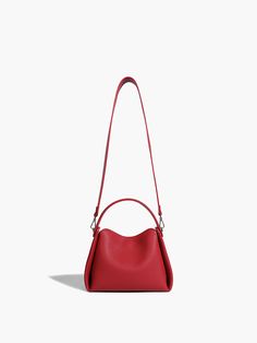 Details Composition: 100% Polyurethane Size & Fit Fit Type: Regular Fit Length: 9.4 inches (24 cm), Width: 3.9 inches (10 cm), Height: 7.5 inches (19 cm) Cm Inch Size One Size One Size Versatile Red Bags For On-the-go, Trendy Red Top Handle Bucket Bag, Trendy Red Pouch Box Bag, Red Leather Satchel With Adjustable Handle, Red Bucket Bag With Top Carry Handle, Modern Red Bag With Adjustable Strap, Red Leather Shoulder Bag With Adjustable Handle, Trendy Red Satchel Bucket Bag, Red Crossbody Box Bag For Shopping