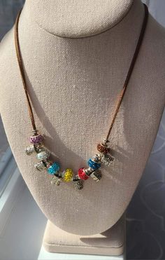 Soft deerskin leather string necklace with silver color metal beads and glittering rhinestone encrusted colorful beads. 20'' long. Christmad Gifts, String Necklace, Holiday Necklace, Rose Pendant, Deer Skin, Elegant Necklaces, Metal Flowers, Shell Pendant, Leather Necklace