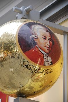 a large golden ball with an image of george washington painted on it's side