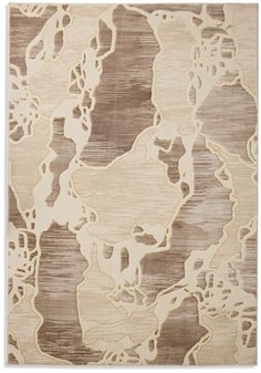 a beige and brown rug with abstract shapes