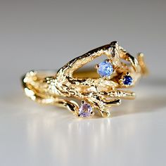 14k solid gold branch ring with 3 sapphires.This nature-inspired ring is a beautiful handmade piece crafted of 14k solid gold. A twig-shaped band is adorned with blue, purple sapphires creating the perfect accessory with a personal touch. The delicate style of this ring reflects a natural simplicity that will become a treasured everyday reminder of nature's beauty. RING SIZE : This ring can be made in all sizes, please choose your ring size from drop down menu. HAND MADE TO ORDER in 15 days after your purchase at our Redlands Studio in California *** All our raw materials are sourced from US-based companies for the quality and safety of our handmade products.*** this ring is handcrafted for you in our local studio in Redlands, California. We are a small workshop which specializes on handma Redlands California, Everyday Reminder, Ring Tree, Gold Branches, Twig Ring, Nature Inspired Rings, Tree Ring, Branch Ring, Jewelry Nature