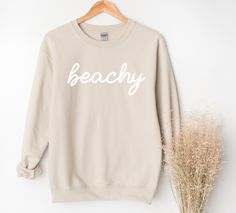 Whether you are taking a sunset stroll on the beach or lounging at home, this beachy sweatshirt will bring you pure comfort.  This unisex heavy blend crewneck is made from polyester and cotton, helping the design come out looking fresh and beautiful. The collar is ribbed knit, so it retains its shape even after washing. There are no itchy side seams on these sweaters. 50% Cotton 50% Polyester Medium-heavy fabric Unisex sizes (See size chart.) Sewn in label Available in 4 colors. Explore all Summ