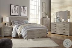 a bedroom scene complete with a bed, dresser and mirror on the wall in grey tones