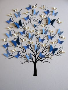 a tree with blue and white butterflies on it