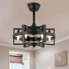 a semi flush ceiling light fixture with four lights in an industrial style design, mounted above a dining room table