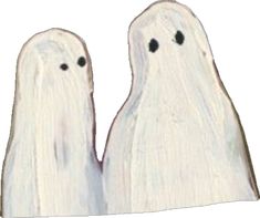 two white ghost dolls standing next to each other