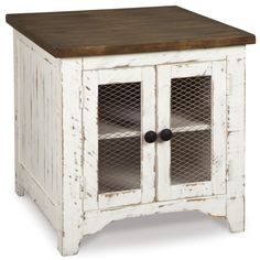 an old white cabinet with two glass doors and a wood top on the bottom shelf