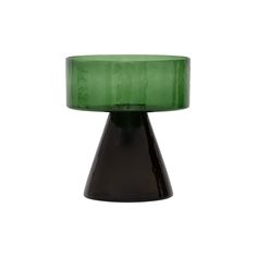 a black and green vase sitting on top of a white surface with no one around it