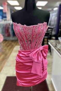 Turn heads at your next event with this striking Strapless Hot Pink Appliques Ruched Homecoming Dress. This dress is designed in a chic sheath silhouette that hugs your curves beautifully while offering a comfortable fit. The delicate lace fabric in vibrant hot pink or bold red adds a touch of elegance, while the ruche Pink Short Hoco Dress, Extra Homecoming Dresses, Hot Pink Dress Short, Short Hot Pink Dress, Quinceanera Dama Dresses, 8th Grade Dance Dresses, Sweet 16 Outfits, Pink Sweet 16, Sneaker Ball