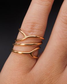 This is a fun new take on our popular Wraparound ring! This ring makes a delicate and minimalist cocktail ring. This listing is for ONE SINGLE Curved Wraparound ring. Made from THICK (1.5mm) metal wire.Available in a SMOOTH or HAMMERED finish.Made from SOLID 14K GOLD. This style is very unique and is sure to turn some heads! We wrap a long length of metal around four times and securely solder it at two points. Every piece is organic and unique — no two Hannah Naomi pieces are exactly alike. Hand Modern 14k Gold Toe Ring, Minimalist Hand Forged Open Midi Rings, Modern Hand Forged Open Ring, Modern Open Ring In Recycled Gold, Elegant Recycled Gold Open Midi Rings, Stackable Open Band Rings In Recycled Gold, Modern 14k Gold Open Ring Stackable Rings, Modern 14k Gold Midi Rings, Modern Hand-forged Open Band Ring