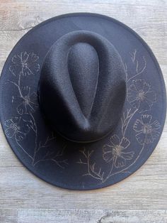 Gorgeous hand burnt freehand designed Fedora hat. Hats measure: 37.5x40x13cm and max head circumference is 57cm but can be adjusted down with a tie that sits within a comfortable band. if you require a larger size please message us after ordering. **Designs can/do vary as they are custom designed** Custom Handmade Curved Brim Top Hat, Custom Handmade Top Hat With Curved Brim, Handmade Country Fedora With Flat Crown, Handmade Country Style Fedora With Flat Crown, Custom Handmade Fedora With Short Brim, Handmade Fedora With Flat Crown For Festivals, Artistic Hat Bands For Festivals, Artistic Adjustable Hat For Rodeo, Artistic Flat Brim Hat Band For Festival