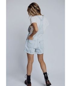 The Levi Vintage Shortalls are a timeless classic, season after season. They have a vintage-inspired look, but feature modern stretch-infused denim for comfort and give. Color: light denim Shell: 79% cotton/21% lyocell Vintage-inspired denim shortalls Adjustable straps Front pouch packet with a four pocket style Machine wash cold, line dry Fits true to size Model is 5’4" wearing an XS Measurements: XS: (0-4) Waist = 31" | Hips = 37" | Rise = 12" | Inseam = 4.8" S: (6-8) Waist = 35" | Hips = 39" Light Wash Bib Front Denim Jumpsuit, Spring Denim Shortalls With Bib Front, Washed Denim Shortalls, Relaxed Fit Cotton Washed Shortalls, Washed Cotton Relaxed Fit Shortalls, Light Wash Bib Front Overalls For Summer, Light Wash Overalls For Spring, Light Wash Relaxed Fit Shortalls With Pockets, Medium Wash Denim Shortalls With Relaxed Fit