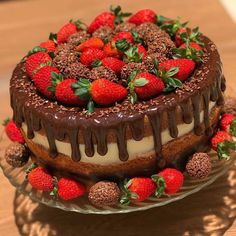 a chocolate cake with strawberries on top