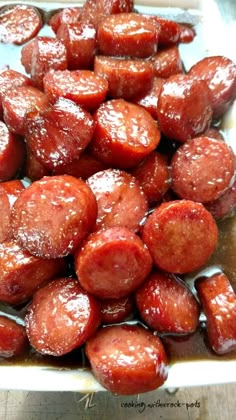 some very tasty looking sausages in a white dish