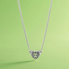 This sterling silver heart necklace symbolizes the radiant nature of faith, featuring intricate details and a small cross cutout at its center. #CrossNecklace #FaithJewelry #JamesAvery Symbolic Sterling Silver Heart Charm Necklaces, Symbolic Sterling Silver Necklaces With Heart Charm, Symbolic Sterling Silver Necklace With Heart Charm, Symbolic Heart-shaped Sterling Silver Necklace, Heart-shaped Sterling Silver Necklace With Oxidized Finish, Heart-shaped Oxidized Sterling Silver Necklaces, Heart Shaped Sterling Silver Necklace With Oxidized Finish, Cross Cutout, Symbols Of Faith