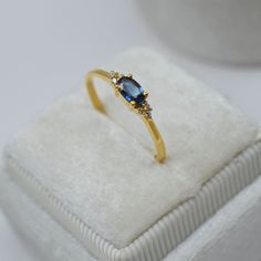 Dainty Sapphire Ring-Blue Sapphire Ring-Oval Cut Sapphire Ring-Stackable Ring-Minimalist Ring-Sterling Silver Ring-14K Solid Gold Ring ❥ Hit on favorite button on shop to get more exciting offers and update for new stock in our shop ❥ Made to order Material: Sterling Silver/10K/14k/18k gold Color Options: Yellow Gold, White Gold, Rose Gold ❥ Center Stone- Natural Blue Sapphire     Size: 3x5mm     Shape: Oval Cut      ❥ Band Width: 1.35 mm ❥ Weight: 1.48 gram approx. (Note:- Weight can be more or less according to the size of the ring) ❥ Shipps within 4-7 business days.  🎁 GIFT WRAPPING * Custom Gift Notes and Gift wrapping is available at our shop. ❥ Why Choose Us? * Well we are experienced with both gemstones and jewelry we are the manufacturers of jewelry.  * Unlike other shops on Etsy Gold Oval Sapphire Cluster Ring, Gold Sapphire Oval Cluster Ring, Oval Sapphire Cluster Ring In Gold, Gold Sapphire Oval Cabochon Ring, Dainty Oval Cabochon Promise Ring, Dainty Yellow Gold Rings With Oval Cabochon, Gold Oval Sapphire Promise Ring, Gold Sapphire Promise Ring, Oval Cut, Oval Gold Sapphire Promise Ring