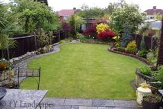 a garden with grass and flowers in it