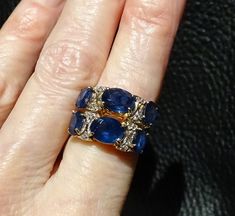 RARE and exquisite Kanchanaburi sapphire ring in excess of 6 carats accented with diamonds in a 14K gold setting The sapphires are the textbook perfect velvety blue coveted by gem collectors. This double band ring is an estate piece which I purchased in 1975. It is in fine condition. The setting is jeweler tested to 14K yellow gold. The gem carat weight is estimated since the gemstones are in the setting. The Kanchanaburi Sapphire gem gravels were discovered in 1918 and are located in the Bo Phl Sapphire Gem, Double Band Ring, Double Band Rings, Jewelry Website, Morganite Ring, Champagne Diamond, Women Pants, Jade Pendant, Multi Stone Ring