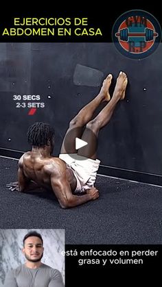 a man laying on the ground in front of a wall