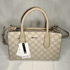 Nine West Allyce Handbag Purse Nyc532906 Mushroom Logo With Triple Entry And 2 Slip Pockets. 19" Adjustable Shoulder Strap And 8" Handle Drop. Magnetic Snap Closure. Faux-Leather In Beige Color With 9 Design Exterior. New With Tags. Nine West Bags Handbags, Cream Shopping Bag With Adjustable Handle, Cream Bags With Adjustable Handle For Shopping, Cream Satchel For Office, Elegant Satchel With Adjustable Handle For Errands, Cream Top Handle Satchel For Shopping, Neutral Satchel Shoulder Bag With Handles, Neutral Rectangular Bag With Handles, Cream Rectangular Satchel With Adjustable Handle