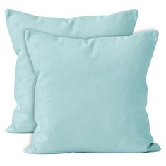 two light blue pillows sitting next to each other